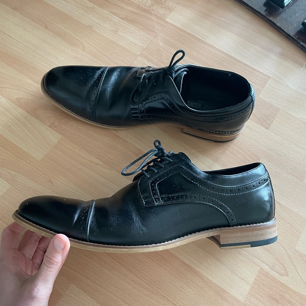 Men’s black dress shoes.